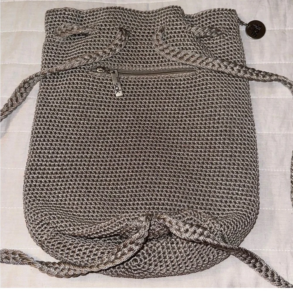 The Sak sling Backpack in the color mushroom